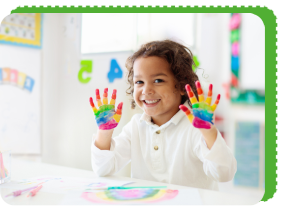 A little girl with her hands painted in rainbow colors.